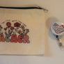 Three-piece teacher gift set with canvas pouch badge reel and silver keychain